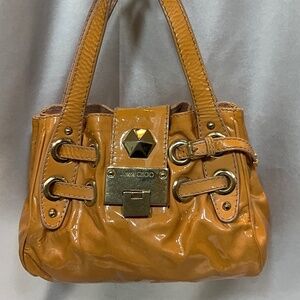 Authentic Jimmy Choo w/ ID tag; pattent leather; tan in color.   36-B7a